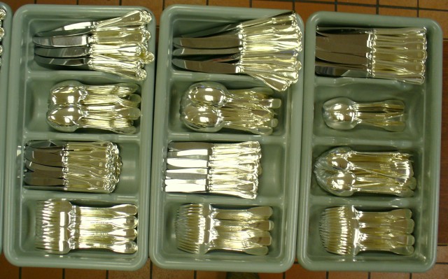 Polishing silver utensils for country clubs